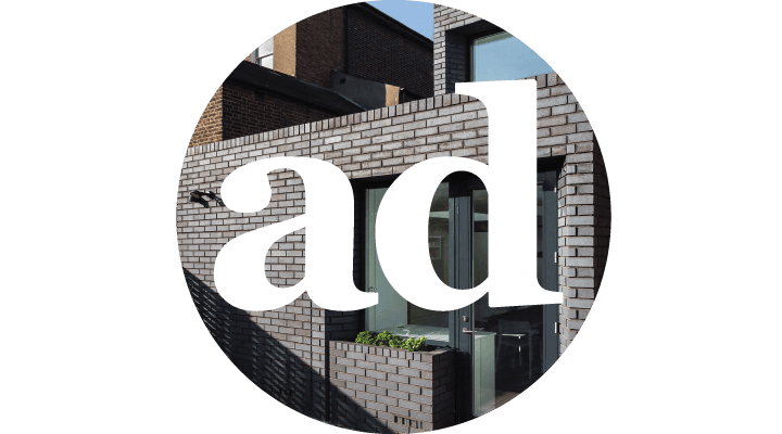 Stylish contemporary brick exterior with large windows, ideal for urban residential or commercial spaces.